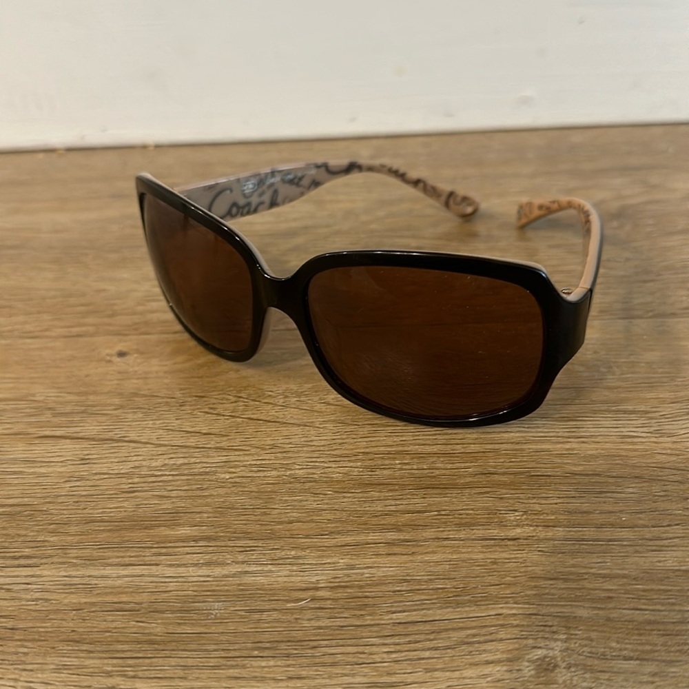 Coach black sunglasses with script logo inside